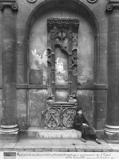 Young Boy Seated Outside the Ecole Nationale des Beaux-Arts, Paris, 1890-1900 by Adolphe Giraudon